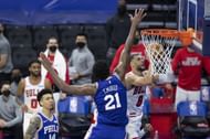 Zach LaVine #8 of the Chicago Bulls shoots the ball against Joel Embiid #21 of the Philadelphia 76ers